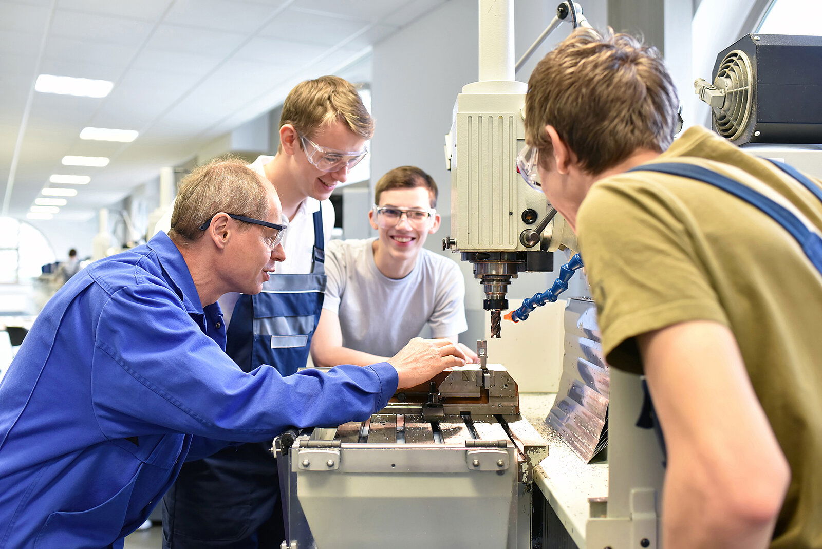 Group of young people in technical vocational training with teacher